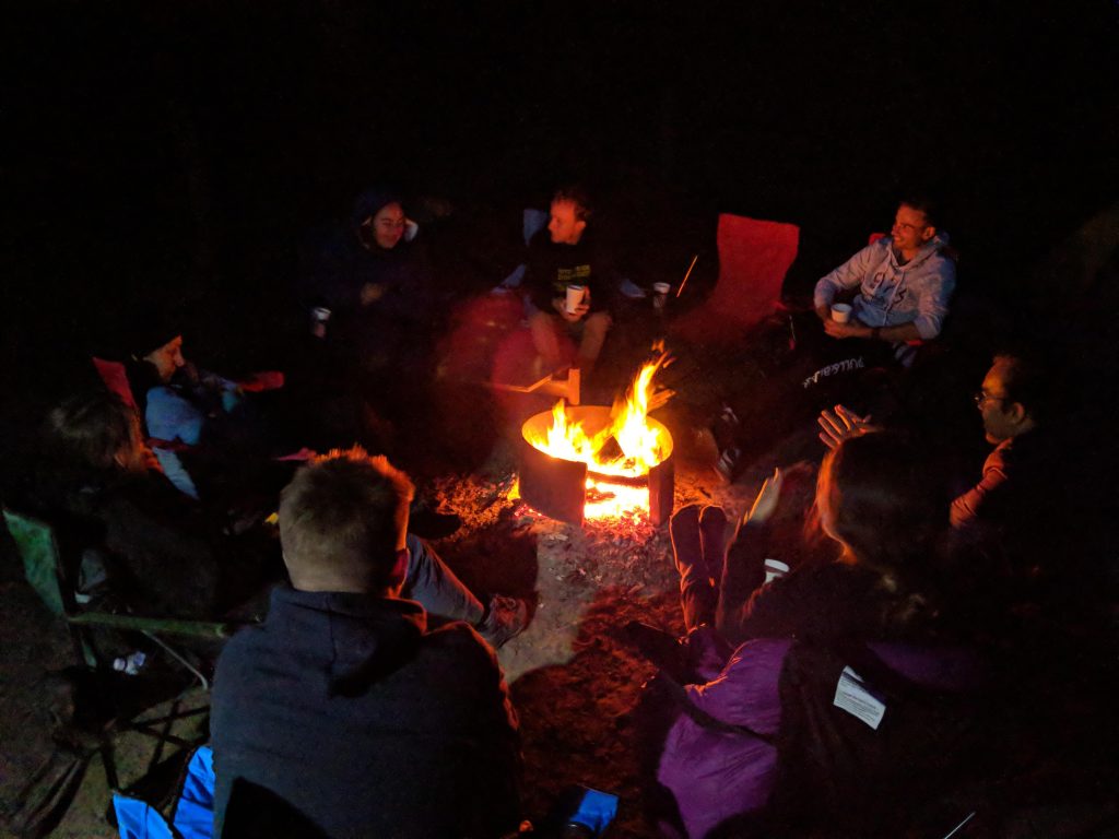 Red wine + fire = happy hikers 