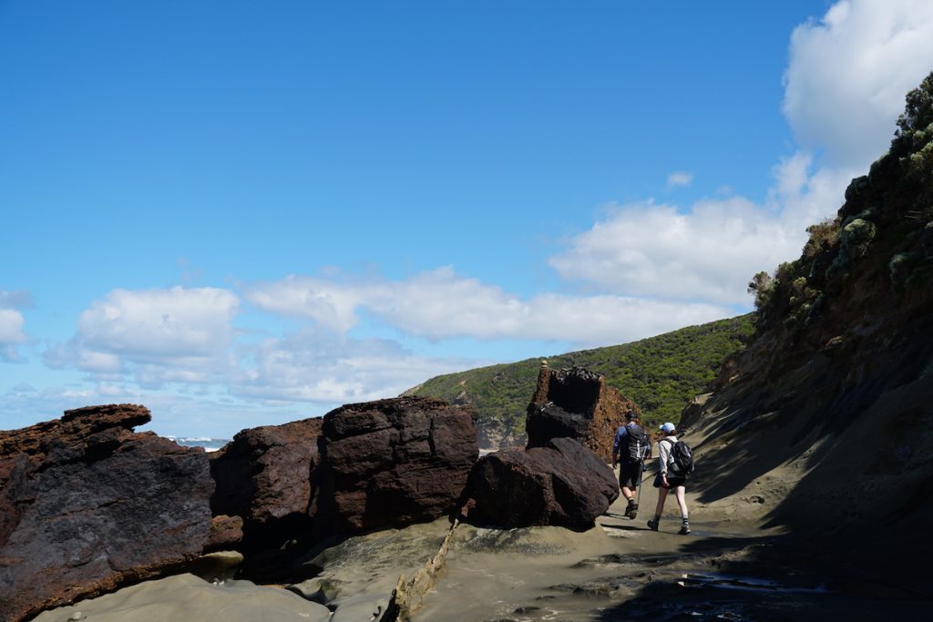 Coastal hiking at low ride along Wreck Beach. 